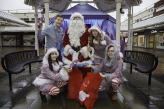 SANTA ARRIVES AT THE PYRAMIDS SHOPPING CENTRE, BIRKENHEAD.... Pictured is Santa at his Grotto with helpers Sparkle (Amy Brumskill), Snowdrop (Ollie Thomas), Twinkle (Laurie Coughlin) and Keelan Early fundraiser from Claire House Hospice.
