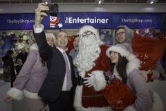 SANTA ARRIVES AT THE PYRAMIDS SHOPPING CENTRE, BIRKENHEAD....Pictured  taking a Santa Selfie  is  Derek Millar shopping centre Director, with Santa ,Twinkle (Laurie Coughlin),  Keelan Early fundraiser for Claire house Hospice, Snowdrop (Ollie Thomas) and Sparkle (Amy Brumskill) .