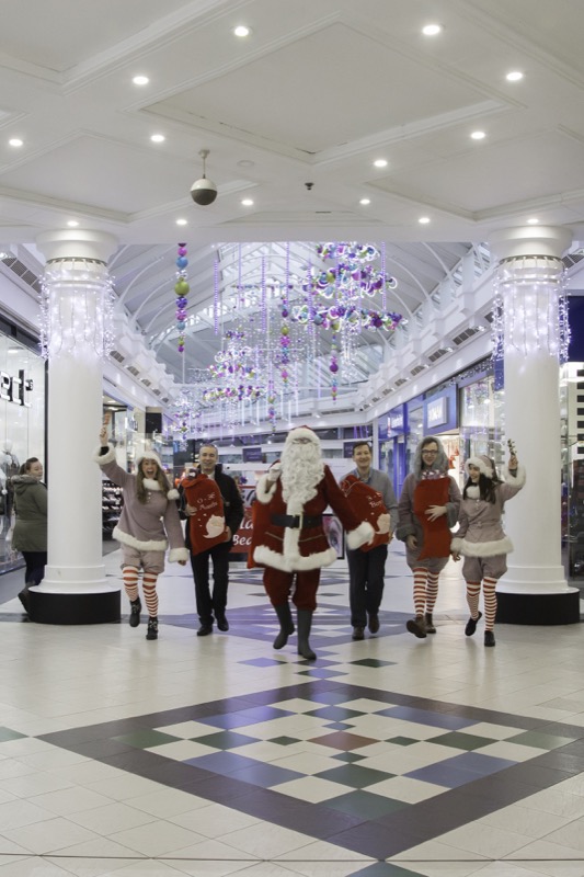 SANTA ARRIVES AT THE PYRAMIDS SHOPPING CENTRE, BIRKENHEAD....Pictured (from left) are  Twinkle (Laurie Coughlin), Derek Millar shopping centre Director,  Santa,  Keelan Early fundraiser for Claire house Hospice, Ollie Thomas (Snowdrop) and Amy Brumskill (Sparkle).